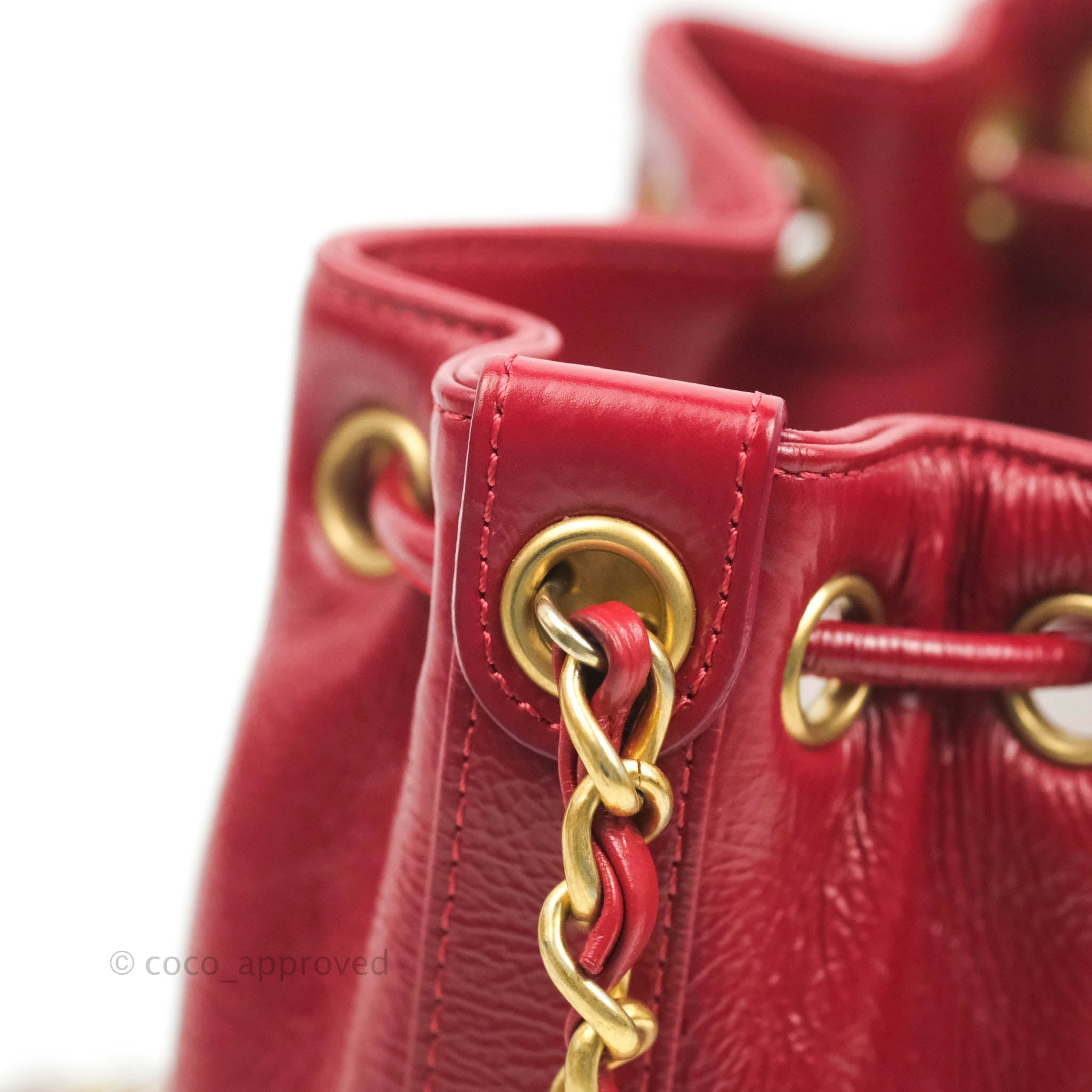 Chanel Shiny Aged Calfskin CC Chain Mini Drawstring Bag Red – Coco Approved  Studio