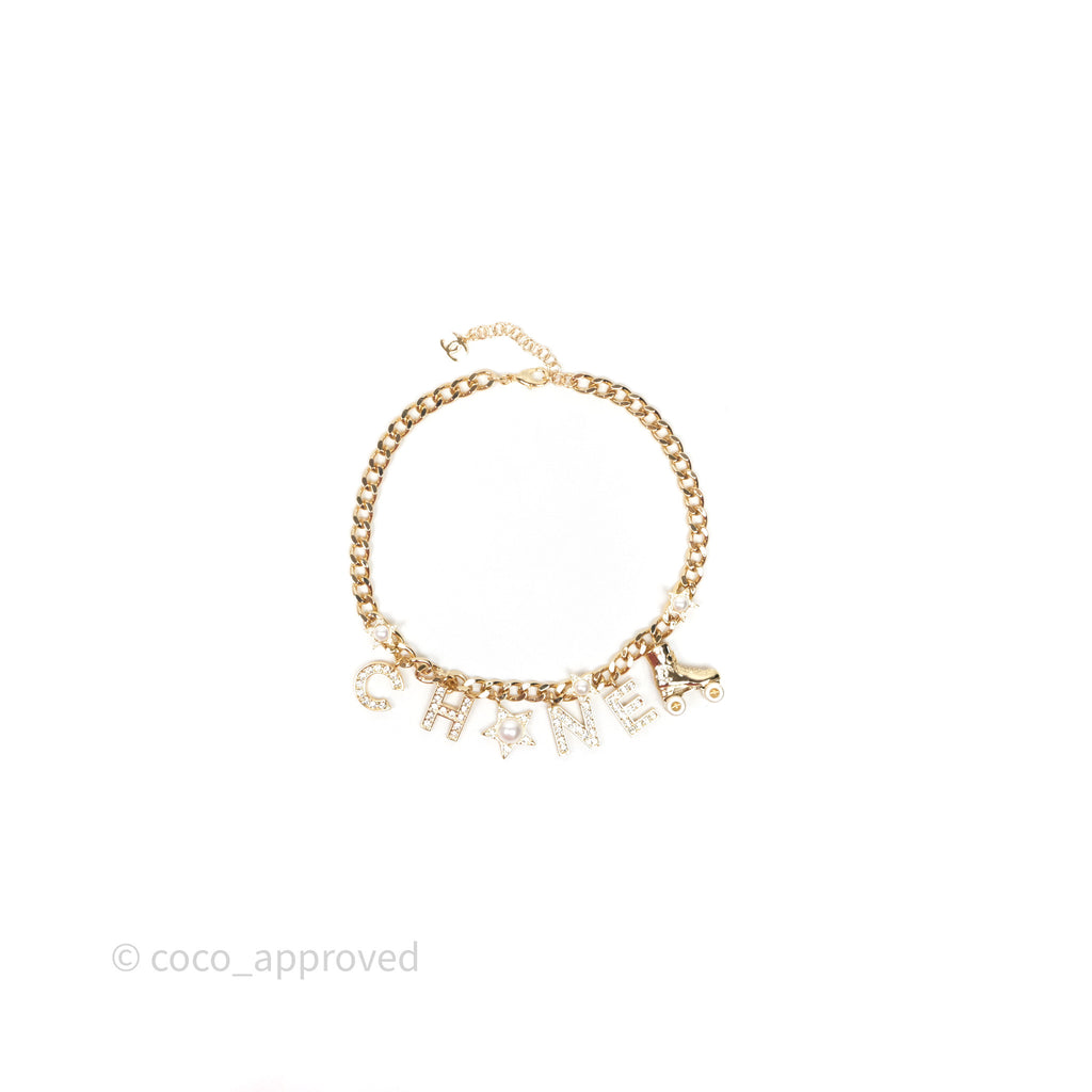 Chanel Pearl Crystal Roller Skate Necklace Gold Tone 24C