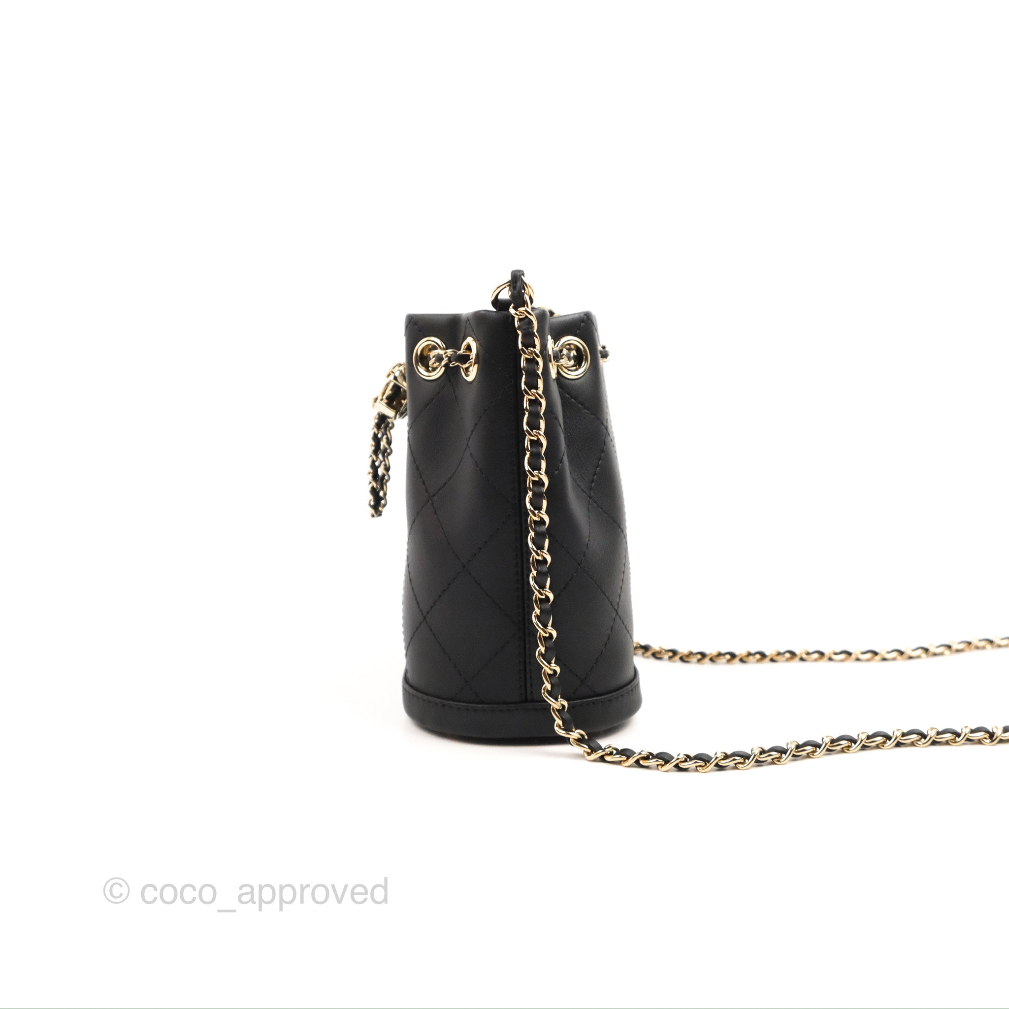 Chanel black bucket bag with logo on the front and gold detail