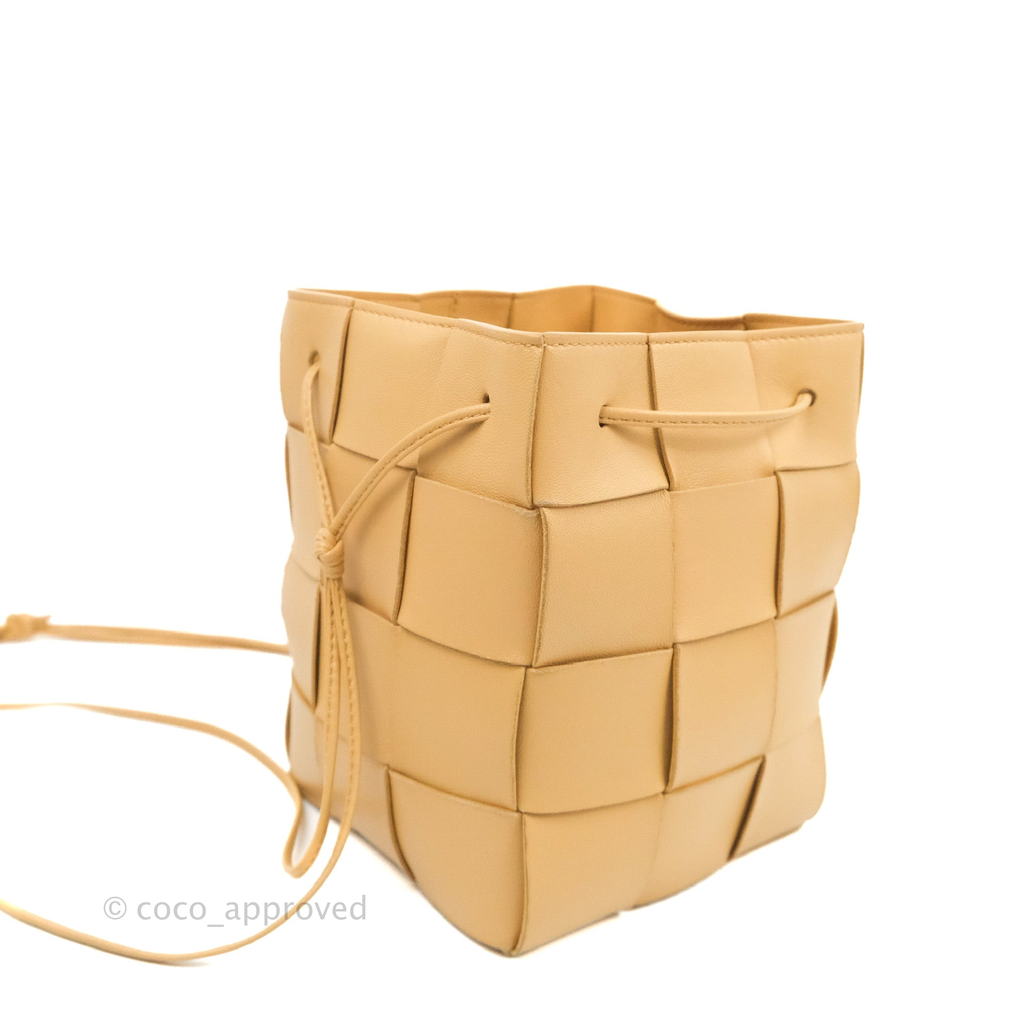 Bottega Veneta® Mini Cassette Bucket Bag in Almond. Shop online now.