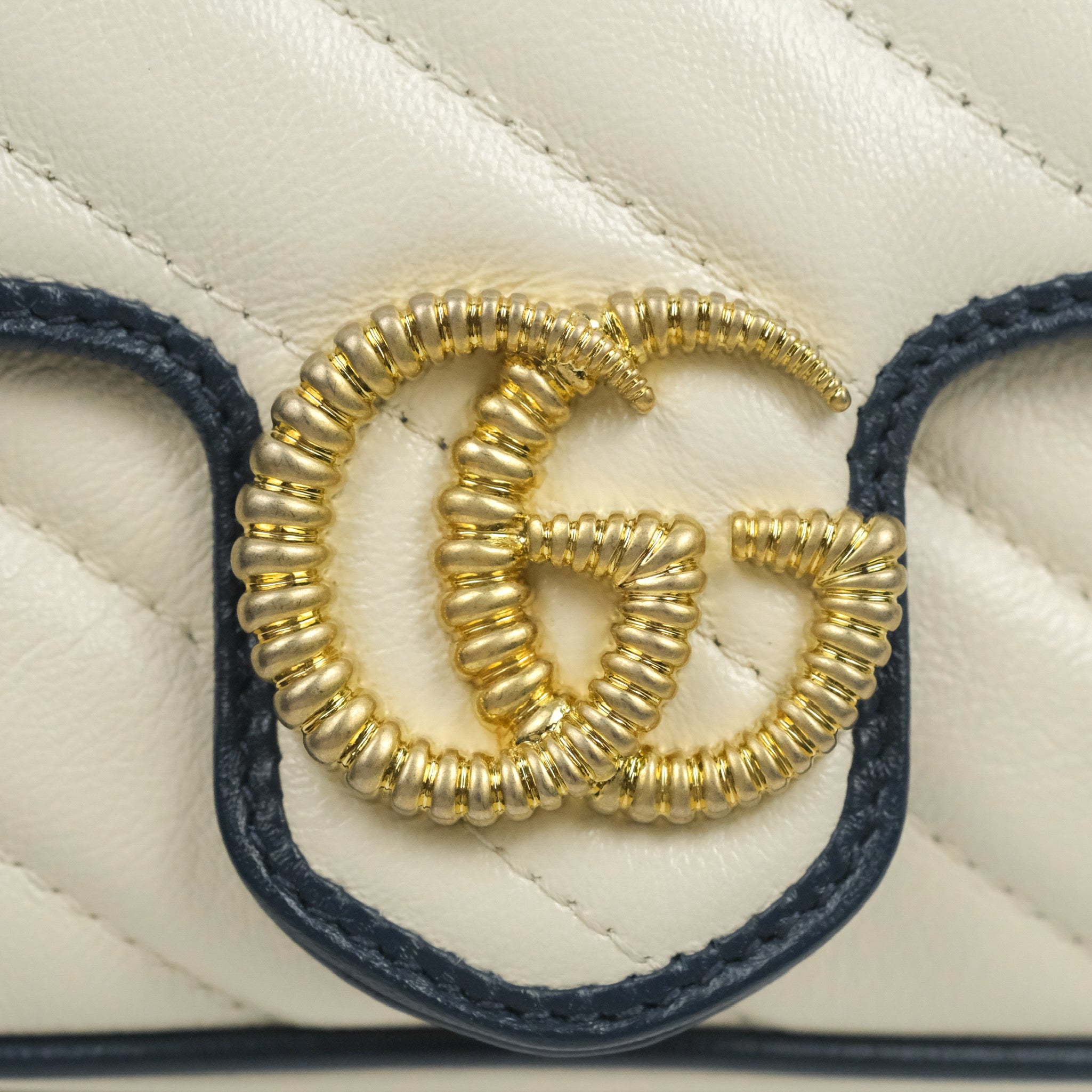 GG Marmont matelassé mini shoulder bag in white leather