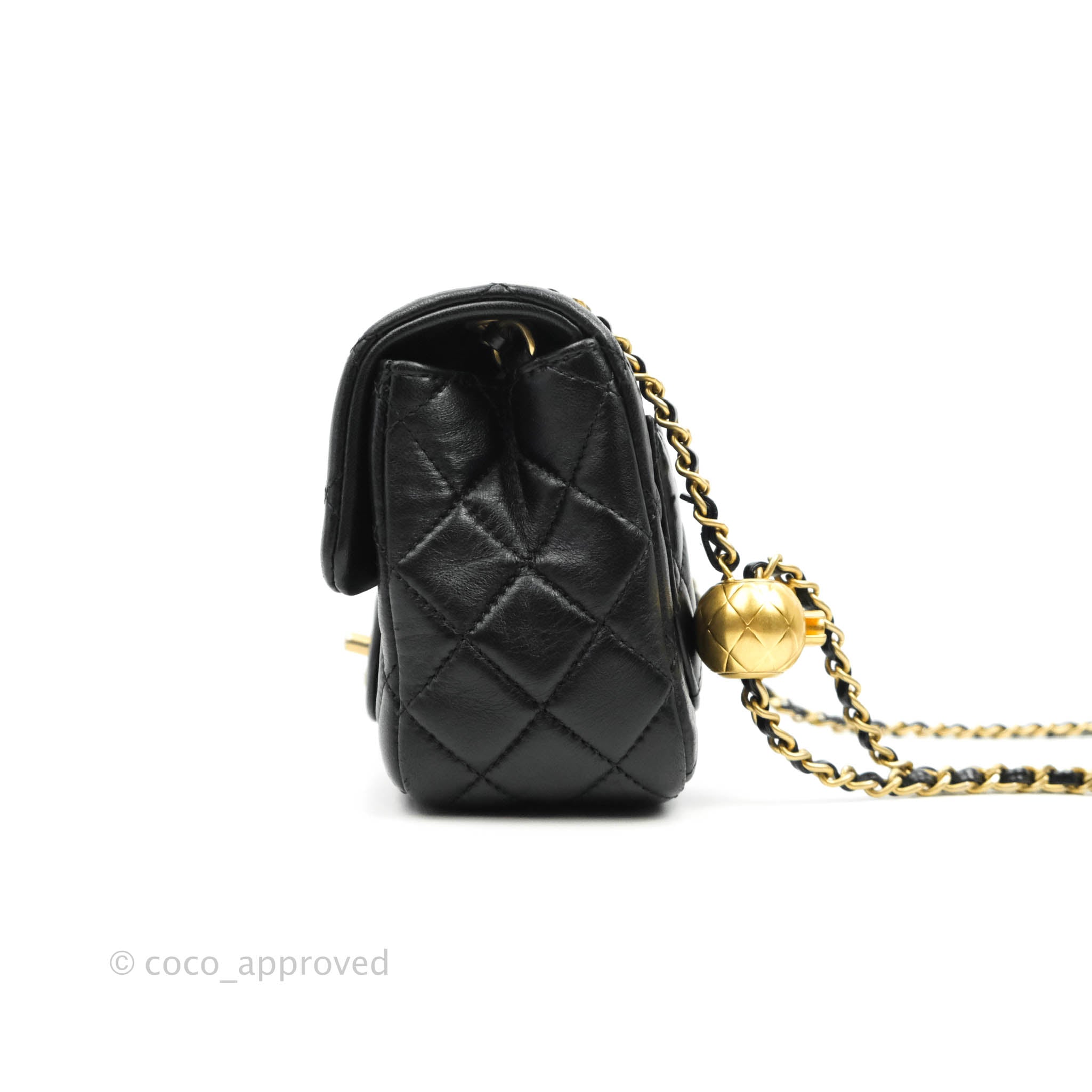 black and gold chanel handbag white