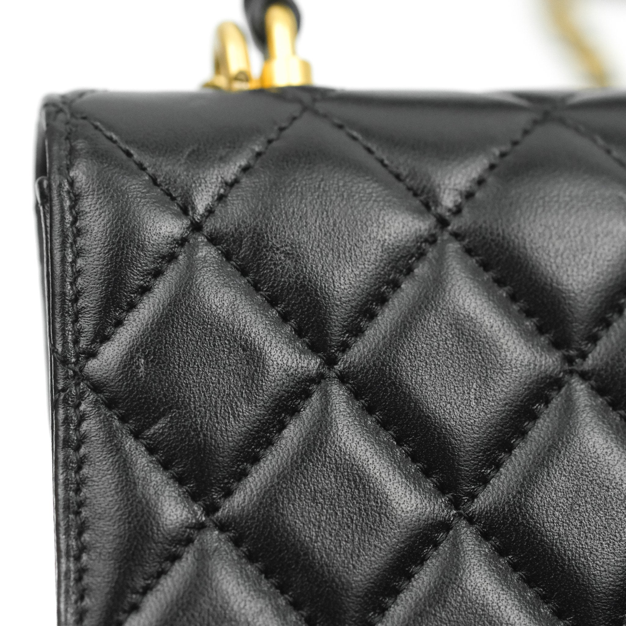 Sold at Auction: Chanel - a mini Beauty Lock flap bag in black